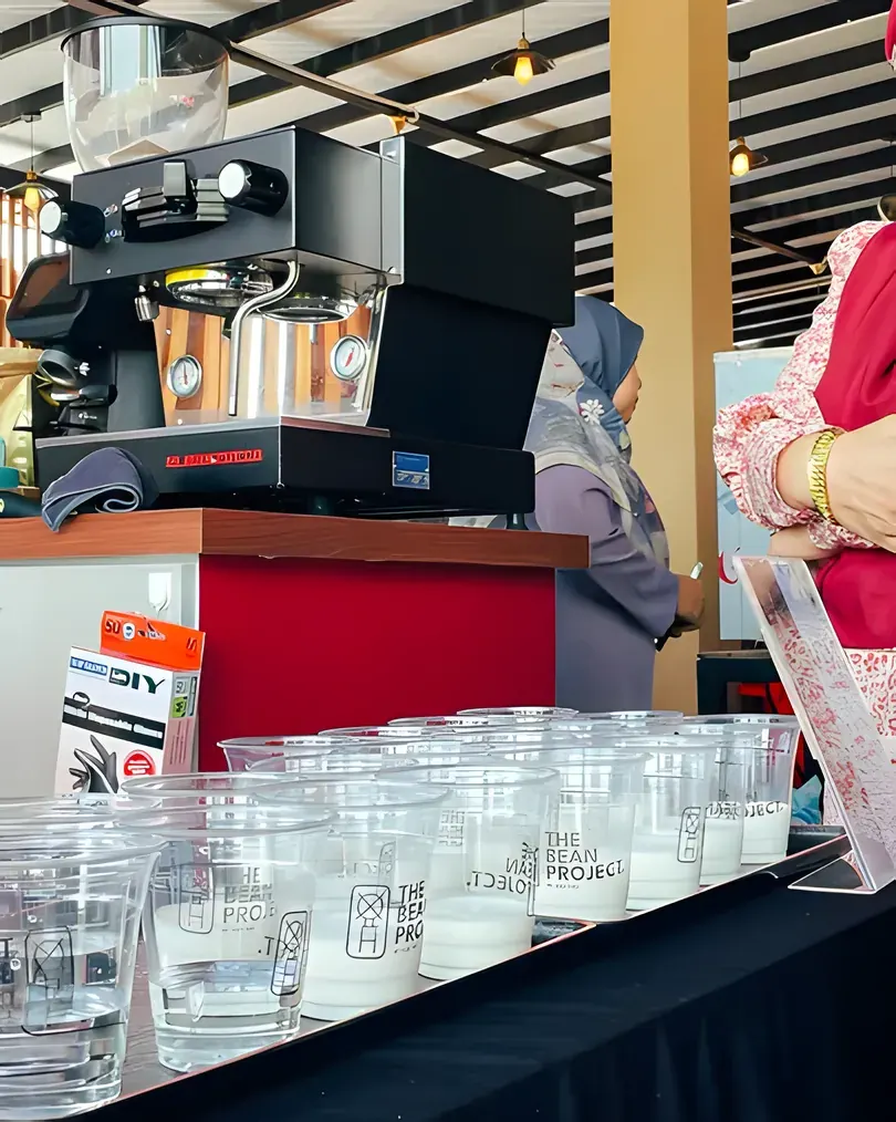 Rows of TBP cups lined up at the bar for a wedding at Pantai Pandak